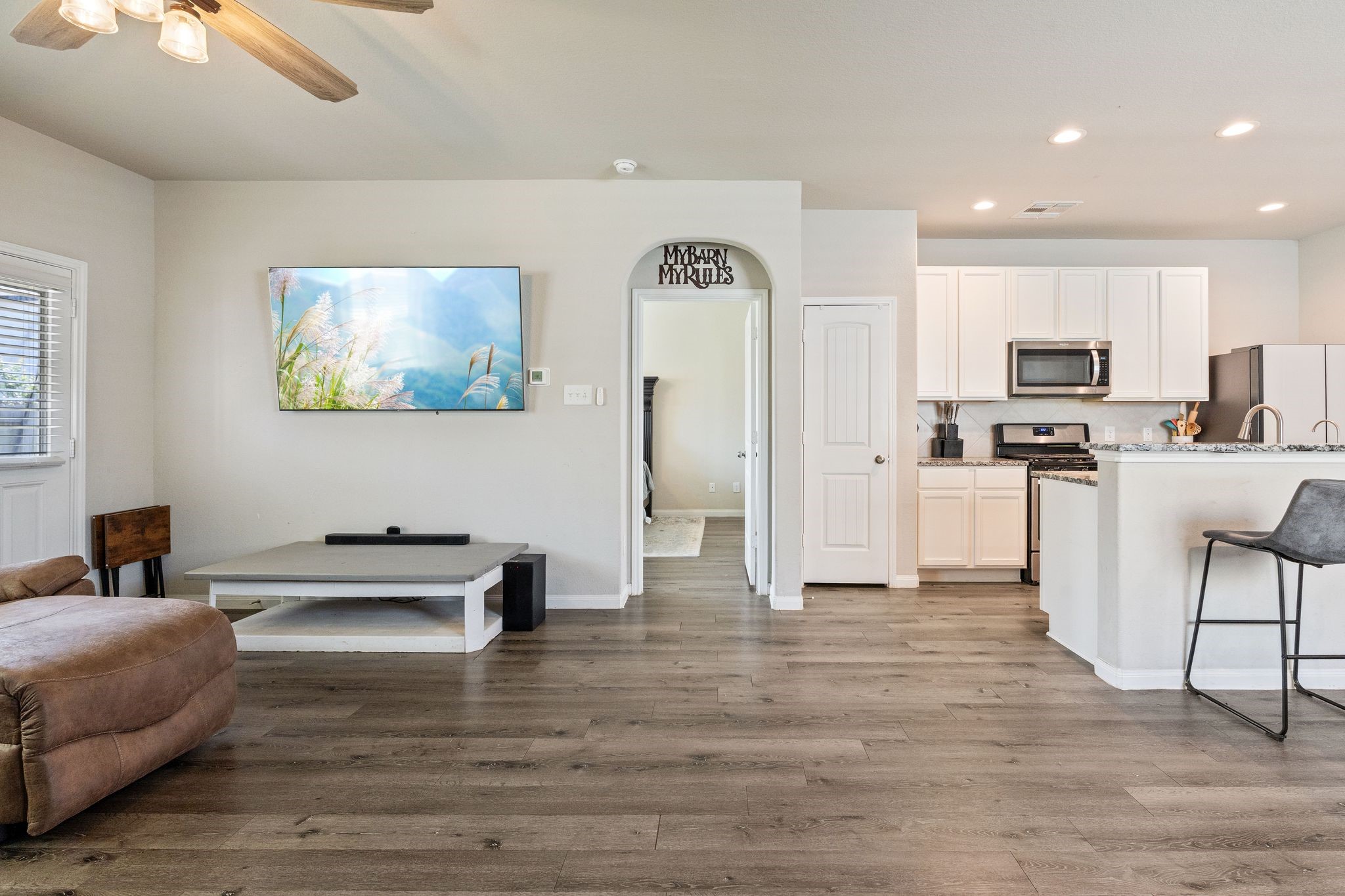 2221 Raider Drive Conroe, TX 77301 - Photo 20 of 42 a living room with stainless steel appliances furniture and a kitchen view