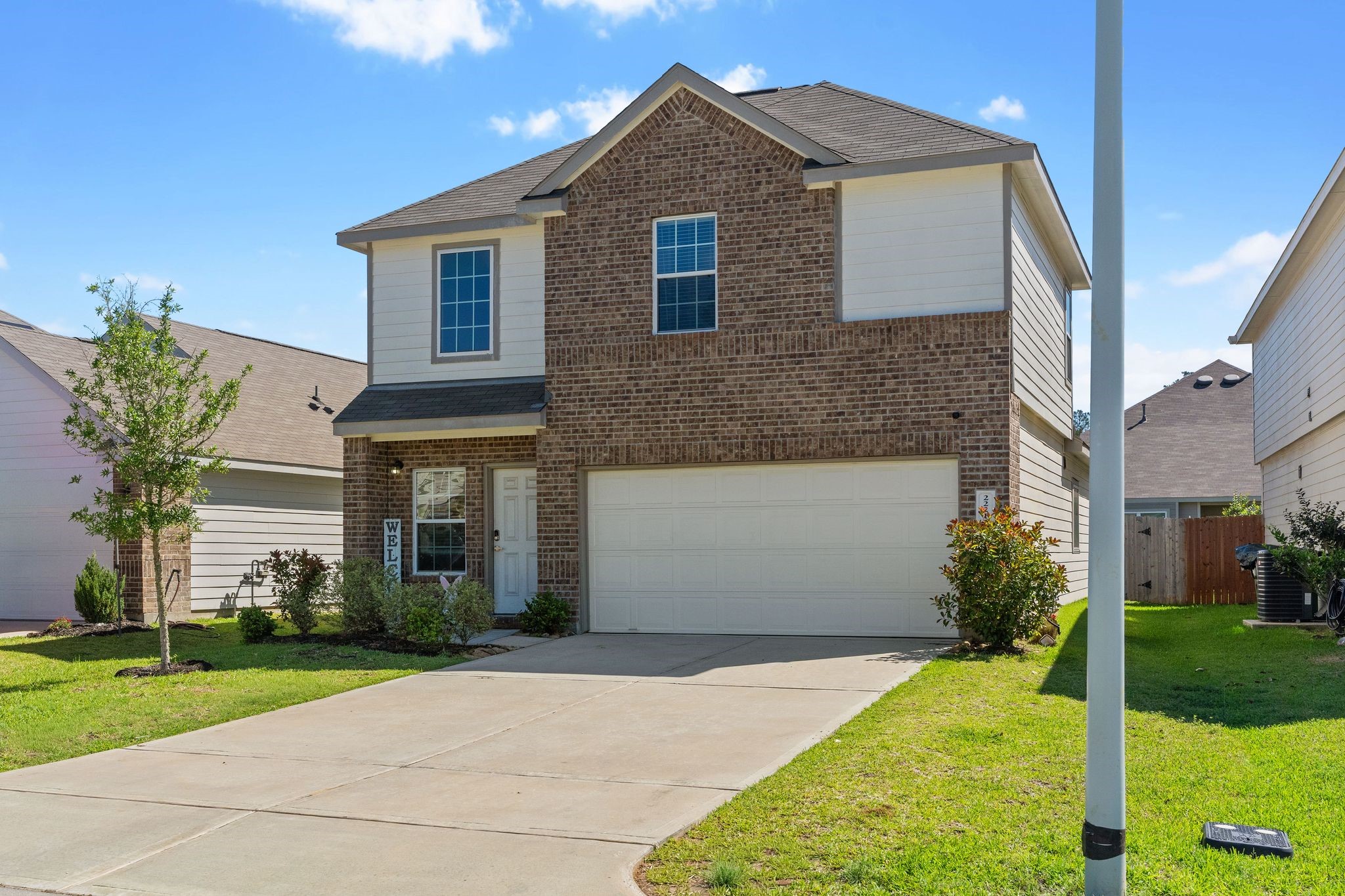 2221 Raider Drive Conroe, TX 77301 - Photo 2 of 42 a front view of a house with a yard