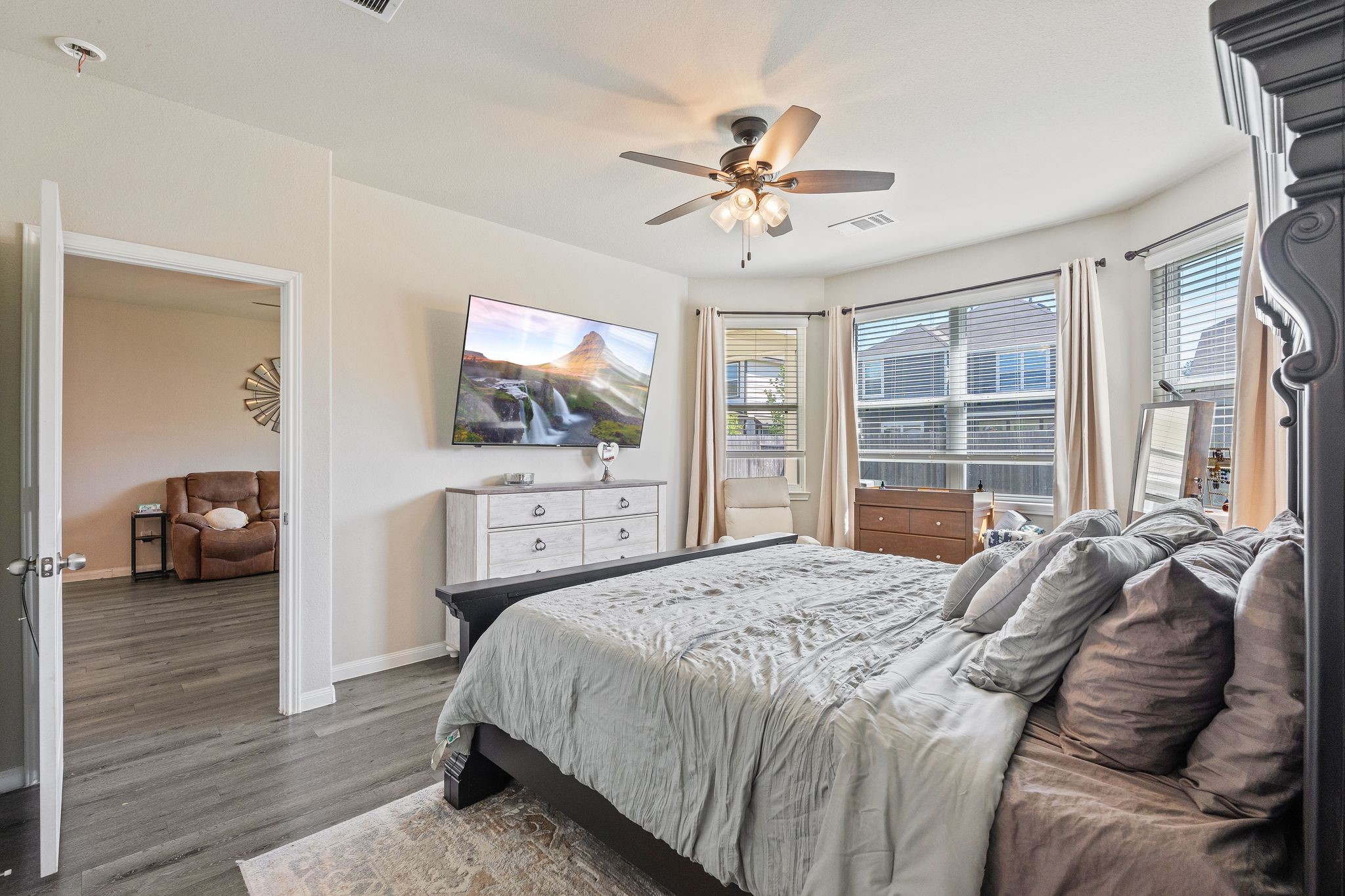2221 Raider Drive Conroe, TX 77301 - Photo 24 of 42 a bedroom with a bed and a large mirror