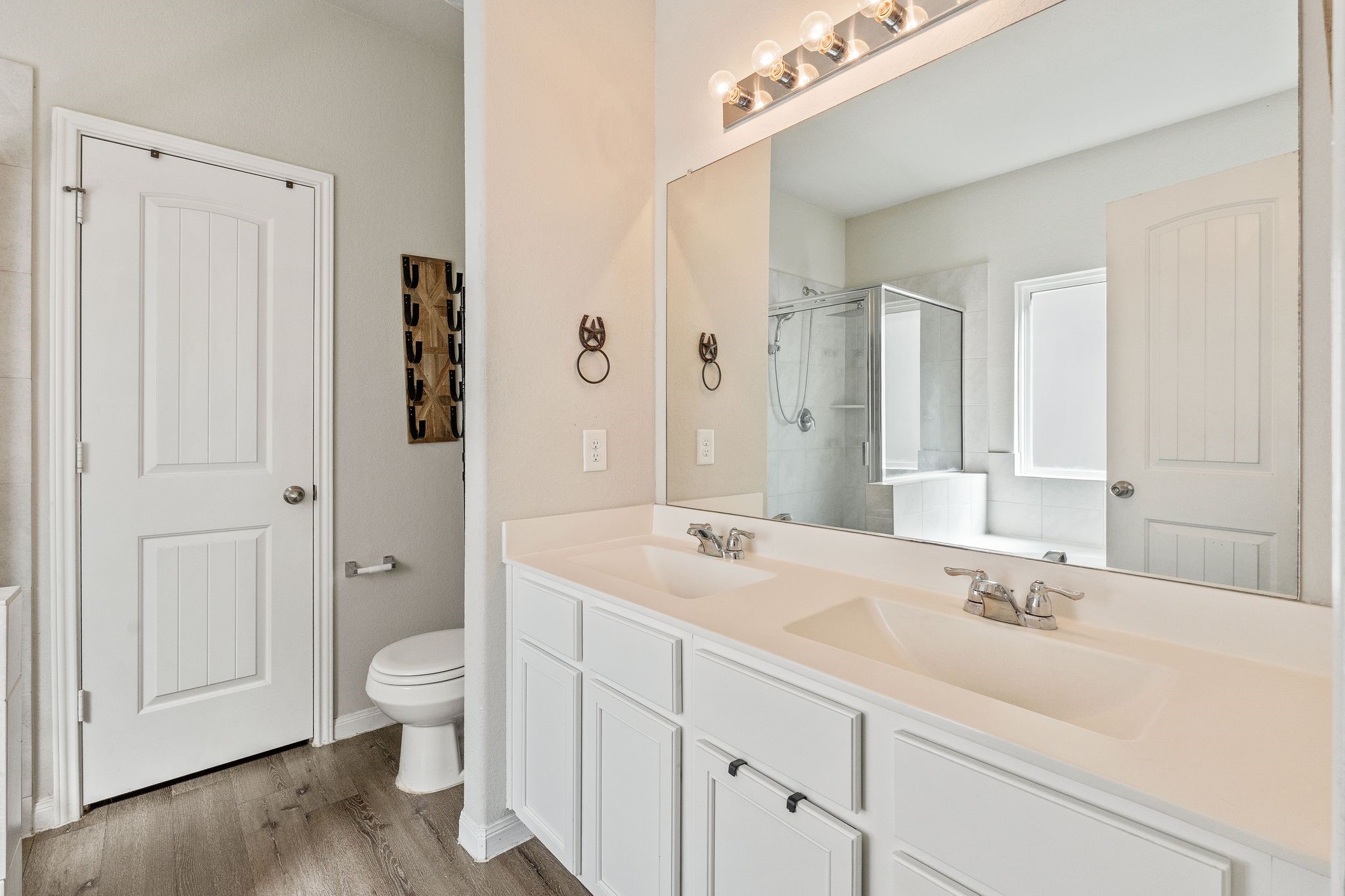 2221 Raider Drive Conroe, TX 77301 - Photo 25 of 42 a spacious bathroom with a granite countertop sink toilet and shower