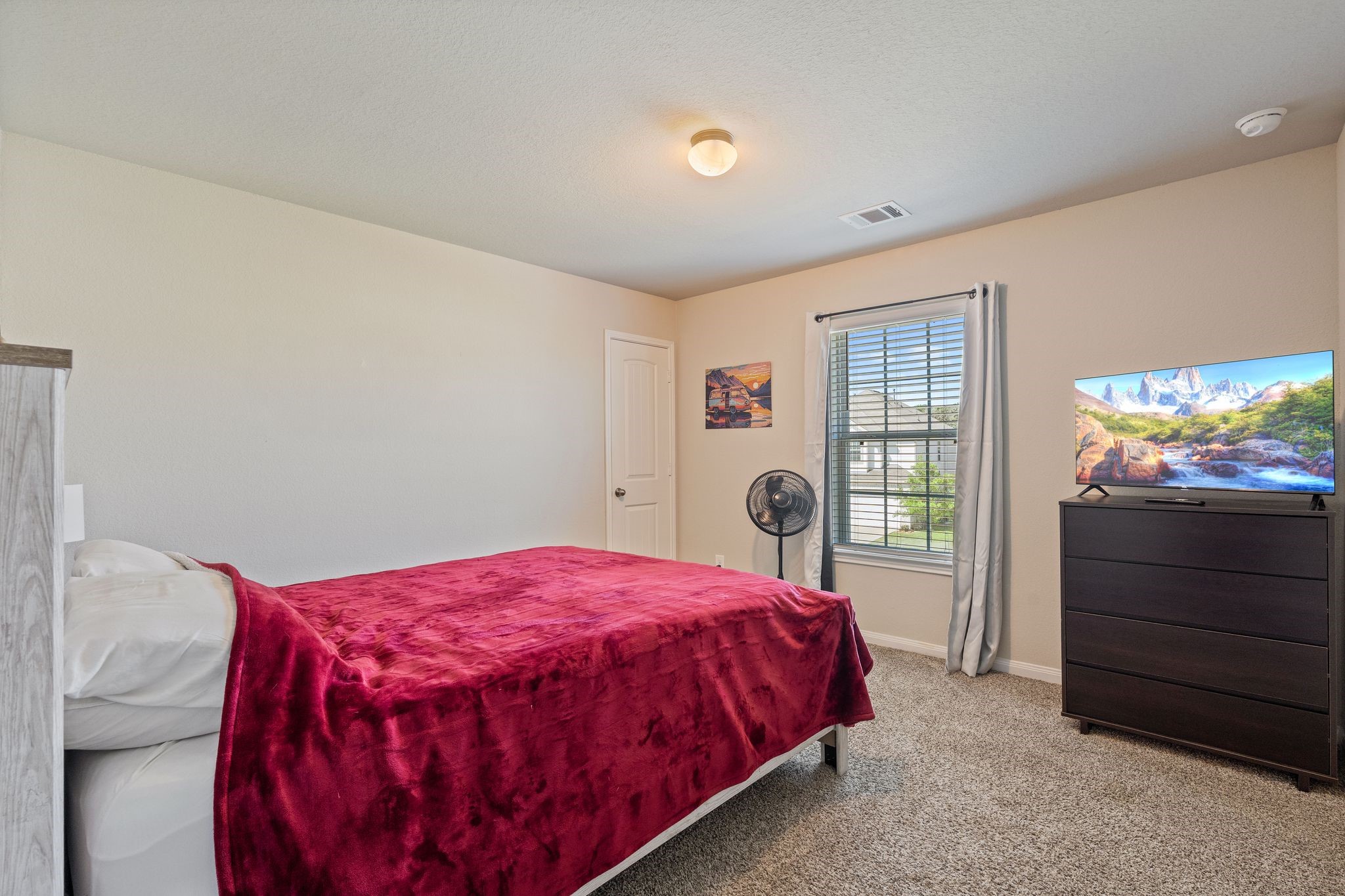 2221 Raider Drive Conroe, TX 77301 - Photo 29 of 42 a bedroom with a bed and a window