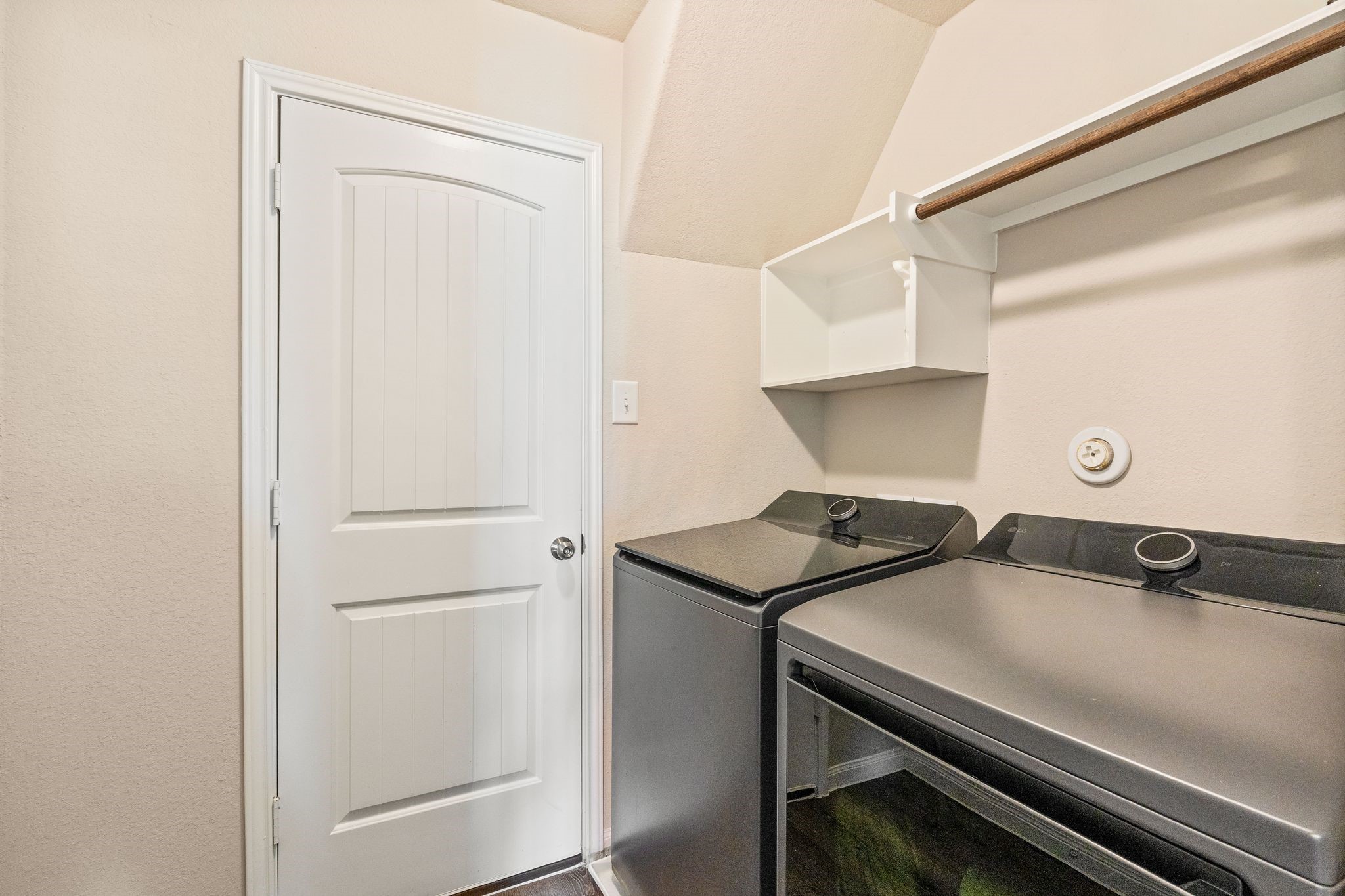 2221 Raider Drive Conroe, TX 77301 - Photo 36 of 42 a view of a storage and utility room with washer and dryer