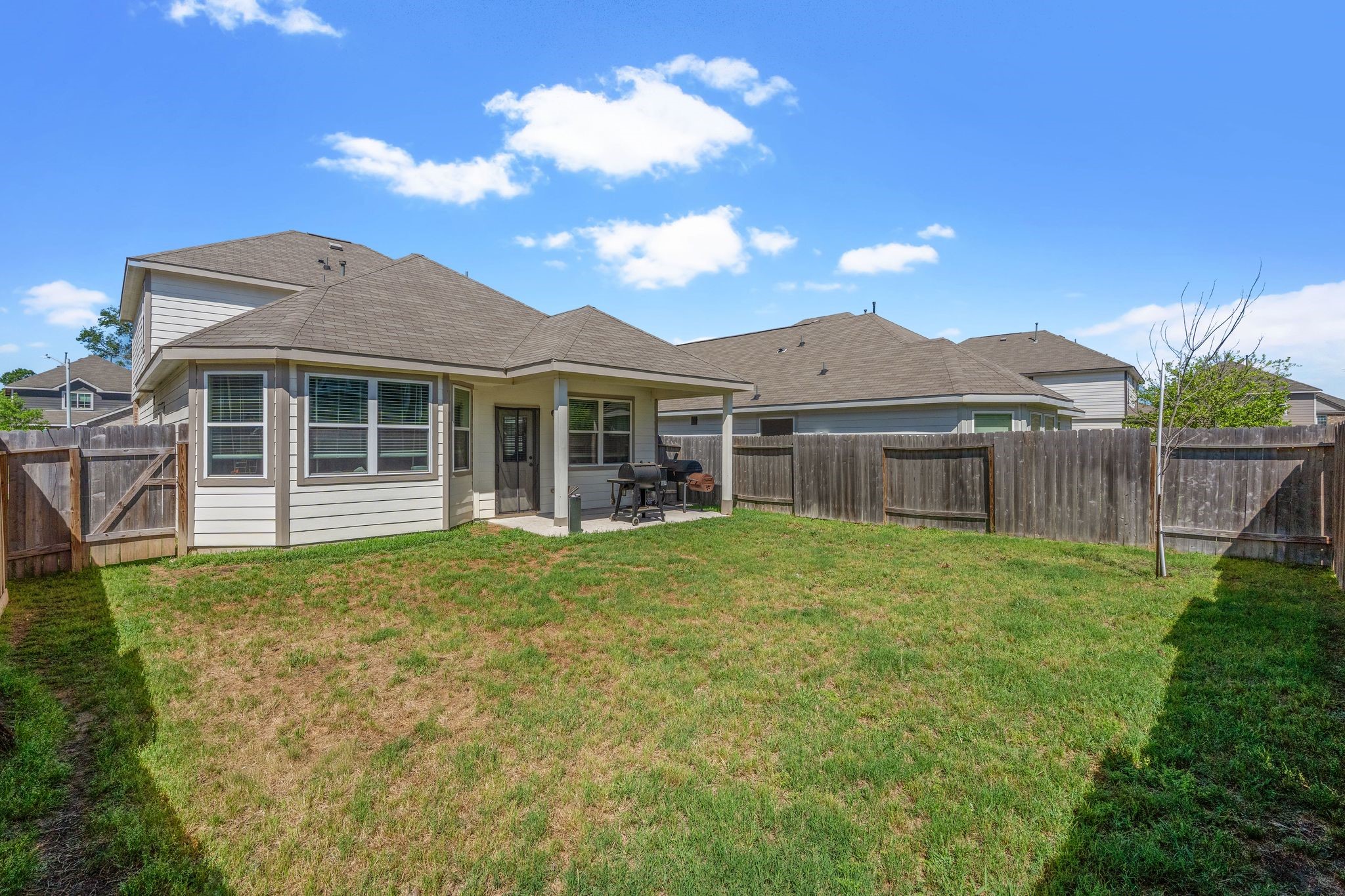 2221 Raider Drive Conroe, TX 77301 - Photo 38 of 42 a front view of a house with a garden