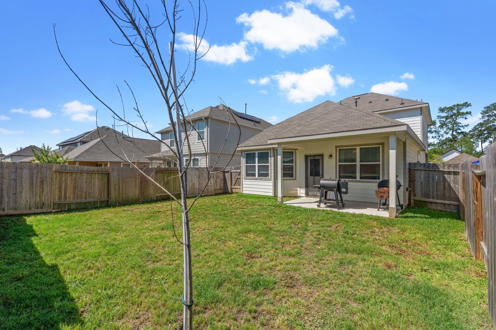 2221 Raider Drive Conroe, TX 77301 - Photo 41 of 42 a house view with a sitting space and garden