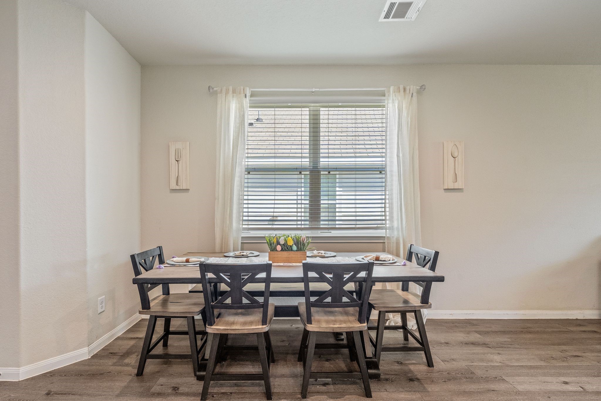 2221 Raider Drive Conroe, TX 77301 - Photo 8 of 42 a view of a dining room with furniture and wooden floor