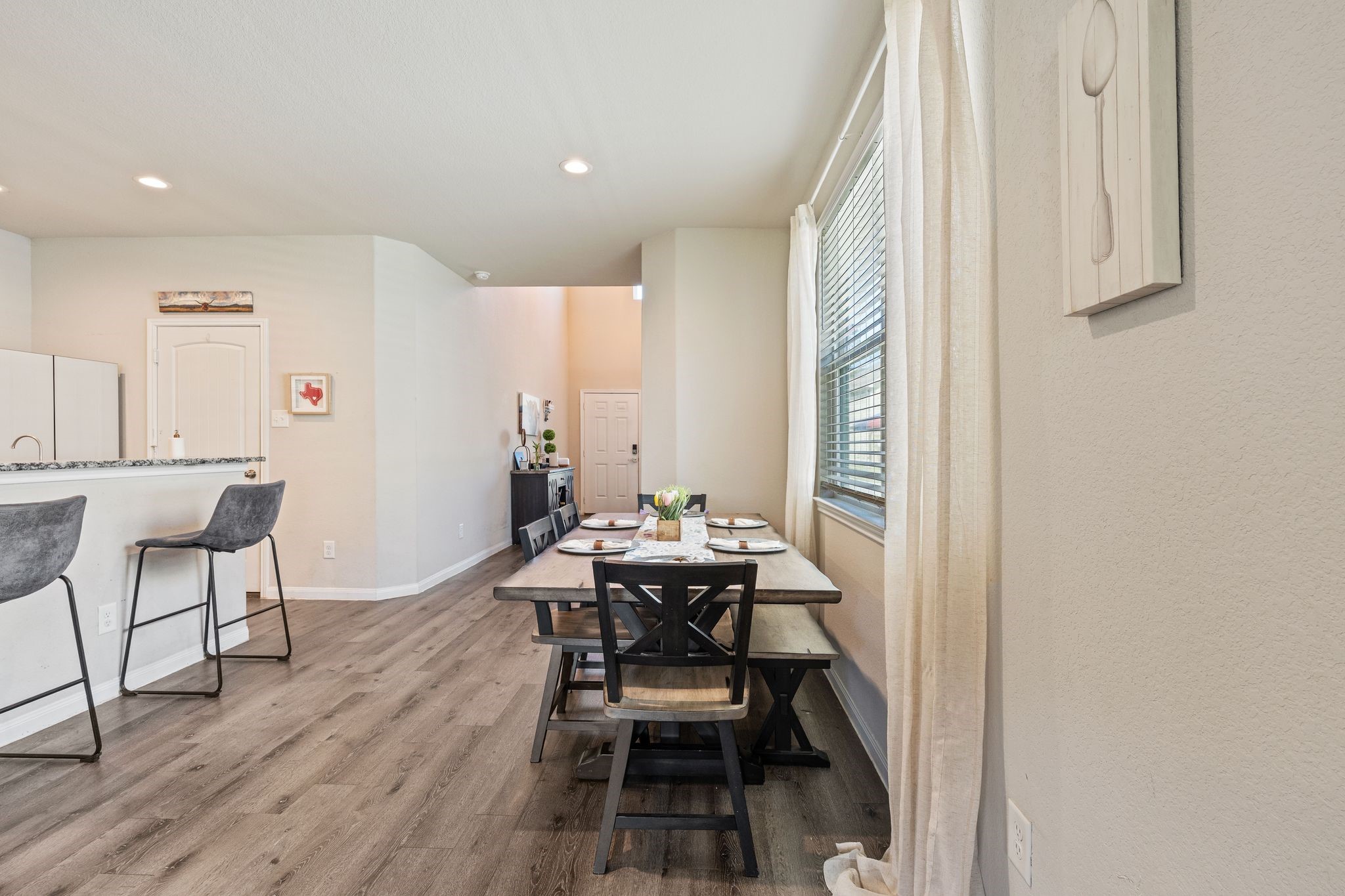 2221 Raider Drive Conroe, TX 77301 - Photo 9 of 42 a dining room with furniture and wooden floor