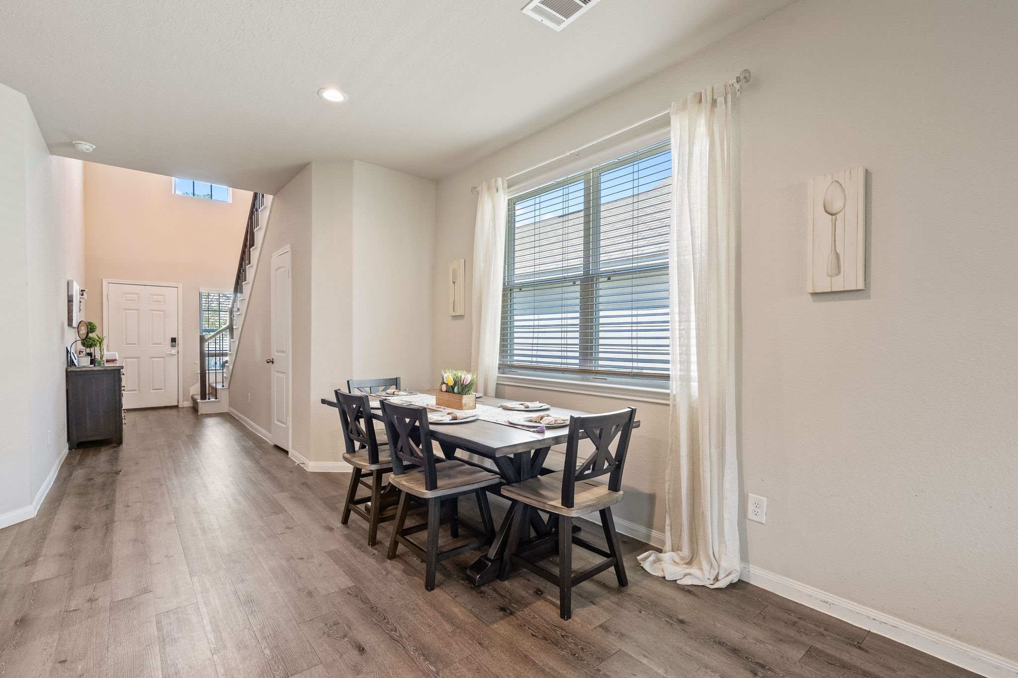 2221 Raider Drive Conroe, TX 77301 - Photo 10 of 42 a view of a dining room with furniture and wooden floor