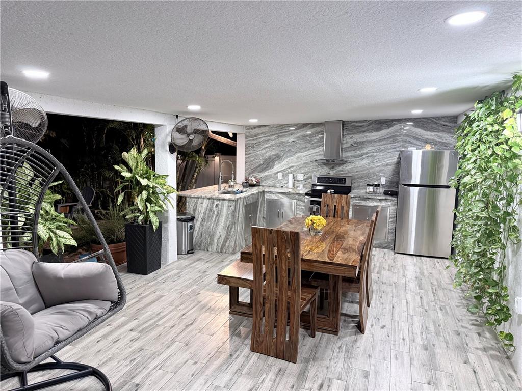 2719 West Braddock Street Tampa, FL 33607 - Photo 23 of 29 a living room with furniture and a wooden floor