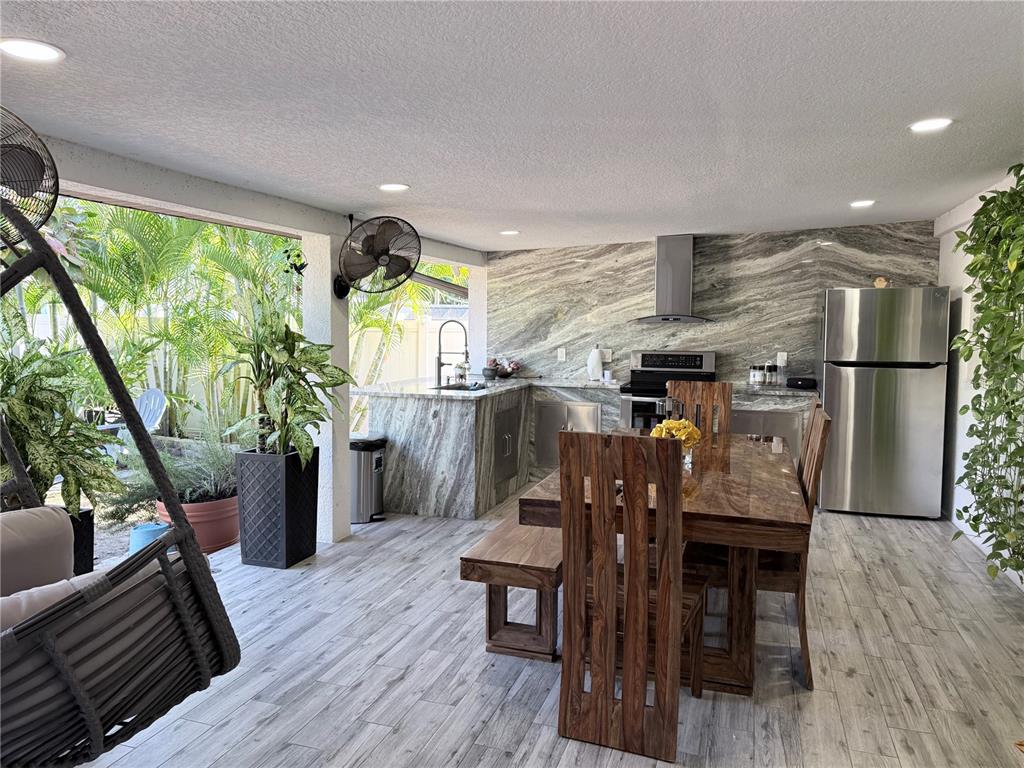 2719 West Braddock Street Tampa, FL 33607 - Photo 25 of 29 a view of a dining room with furniture window and wooden floor