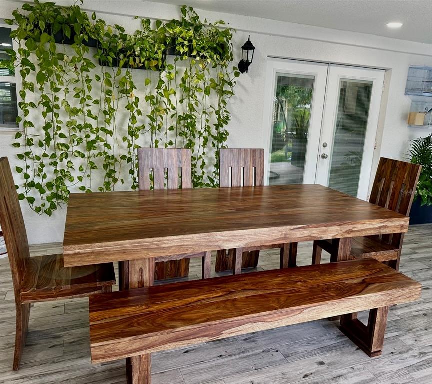 2719 West Braddock Street Tampa, FL 33607 - Photo 28 of 29 a view of a wooden chairs and table on the wooden floor
