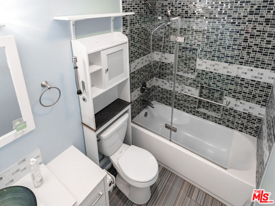 15511 Sherman Way, Unit 17 Van Nuys, CA 91406 - Photo 11 of 47 a bathroom with a toilet and a bathtub