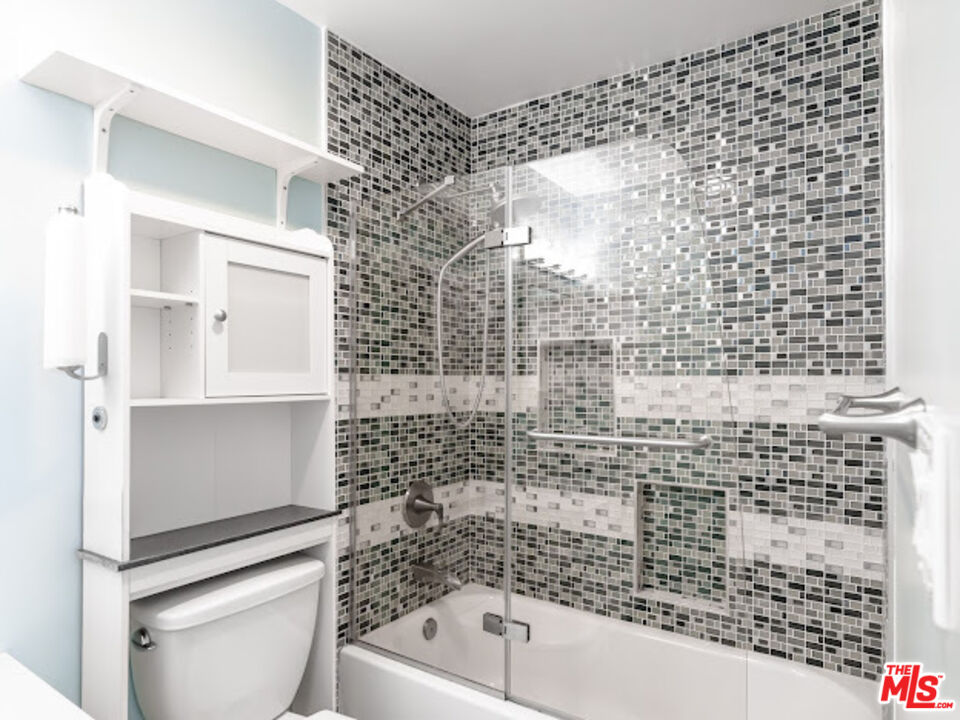 15511 Sherman Way, Unit 17 Van Nuys, CA 91406 - Photo 12 of 47 a bathroom with a shower toilet and sink