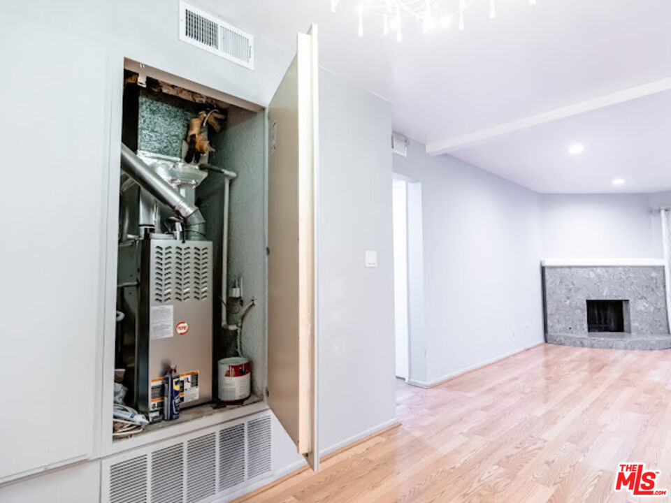 15511 Sherman Way, Unit 17 Van Nuys, CA 91406 - Photo 19 of 47 a view of a livingroom with a fireplace and entryway