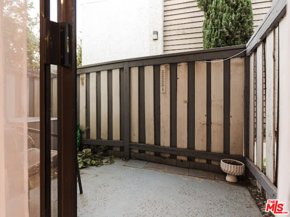 15511 Sherman Way, Unit 17 Van Nuys, CA 91406 - Photo 32 of 47 a view of a porch with a small yard
