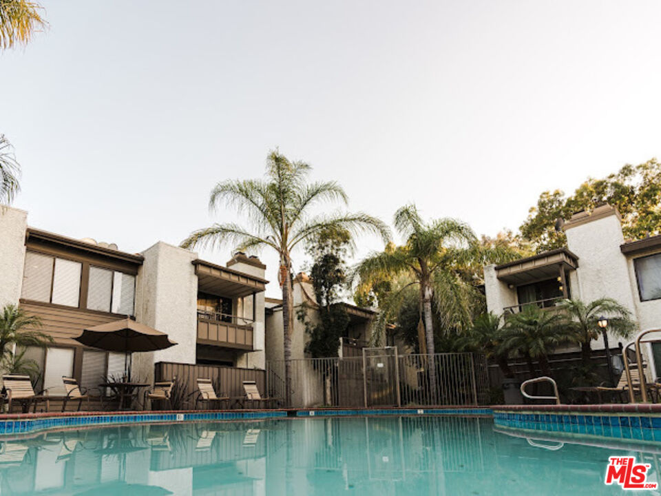 15511 Sherman Way, Unit 17 Van Nuys, CA 91406 - Photo 34 of 47 a swimming pool view with a outdoor seating