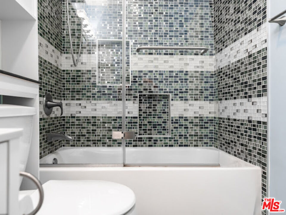 15511 Sherman Way, Unit 17 Van Nuys, CA 91406 - Photo 10 of 47 a bathroom with a bathtub and shower