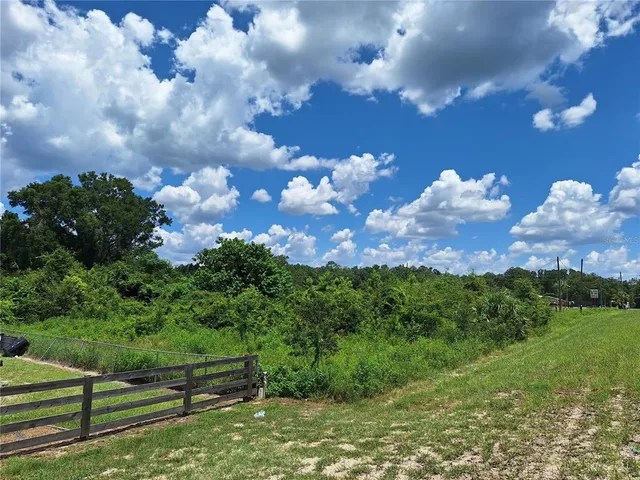 a view of a building with a big yard
