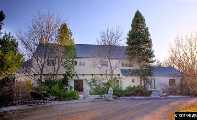 2700 Holcomb Ranch Lane Reno, NV 89511 - Photo 1 of 9 a front view of a house with a yard and tree s