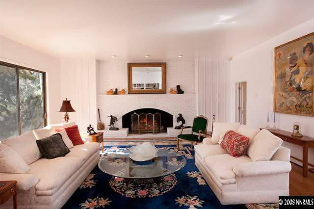 2700 Holcomb Ranch Lane Reno, NV 89511 - Photo 4 of 9 a living room with furniture and a fireplace