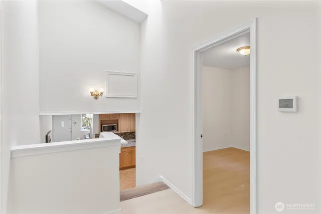 a bedroom with a bed and a potted plant