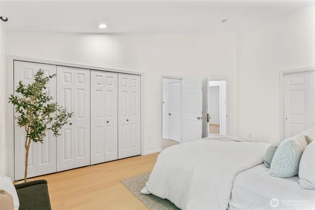 a bathroom with a tub sink and mirror