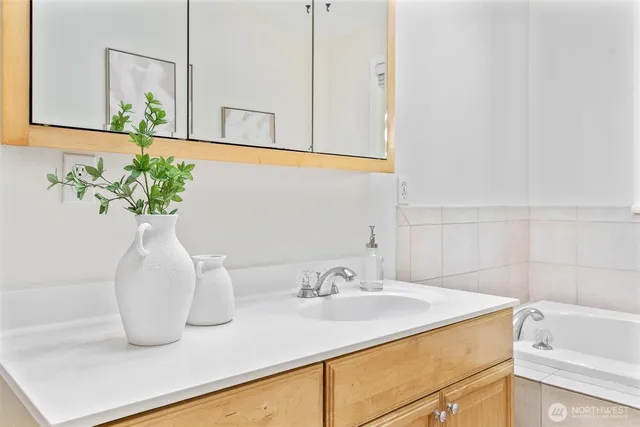 a bathroom with a toilet a sink and shower