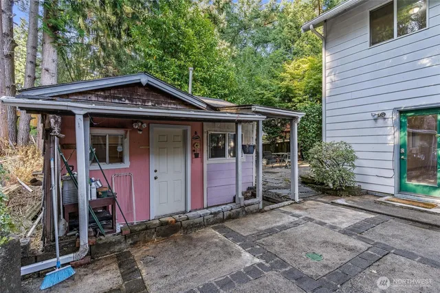 a view of a patio with table and chairs and potted plants