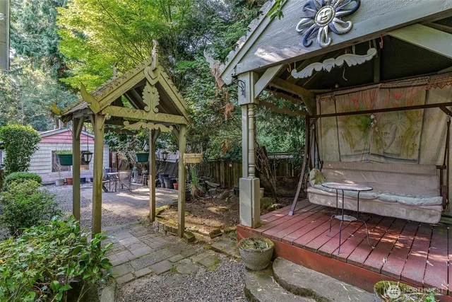 a view of backyard with patio and outdoor seating