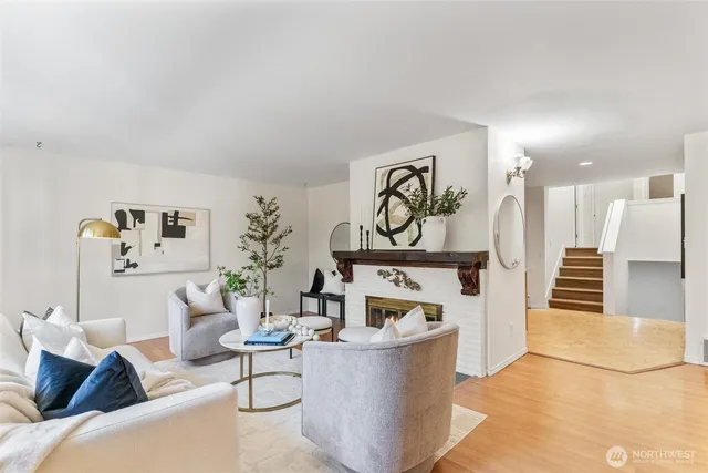 a living room with furniture and kitchen view
