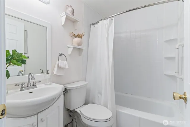 a kitchen with a sink and white cabinets