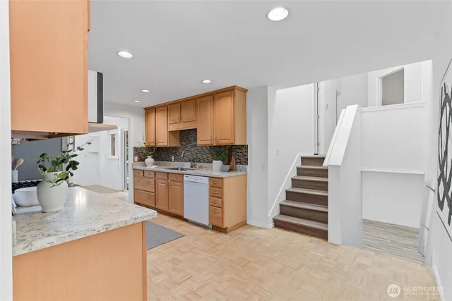 a kitchen with a sink stove and refrigerator