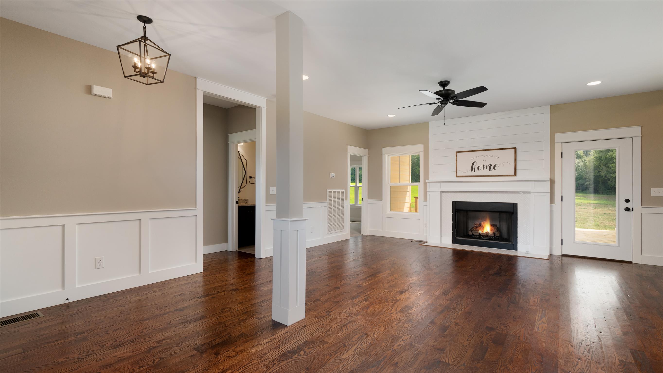 485 Tom Link Road Cottontown, TN 37048 - Photo 11 of 30 a view of a livingroom with wooden floor a fireplace