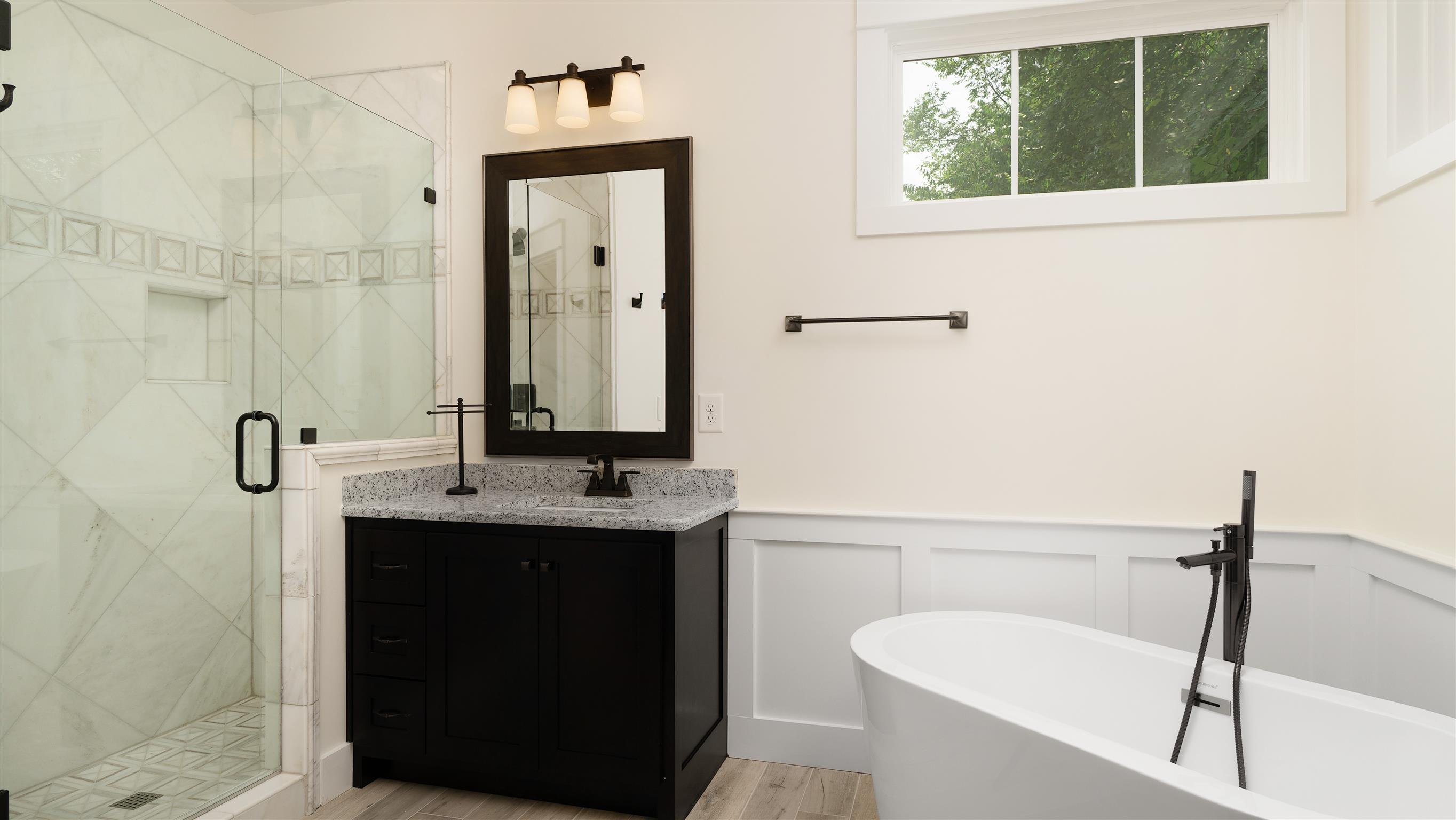 485 Tom Link Road Cottontown, TN 37048 - Photo 16 of 30 a bathroom with a tub sink and mirror