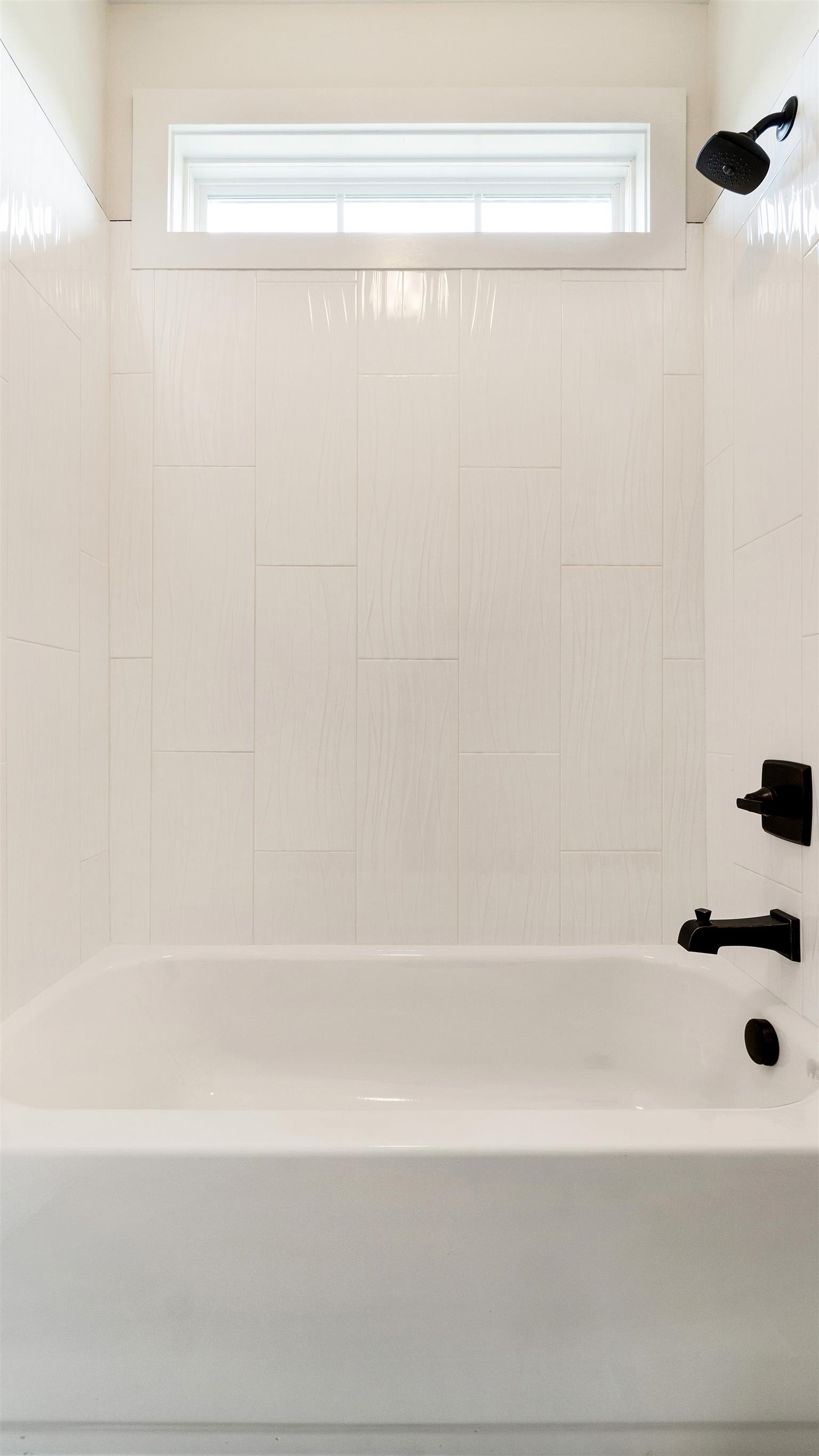 485 Tom Link Road Cottontown, TN 37048 - Photo 22 of 30 a bathroom with a bathtub