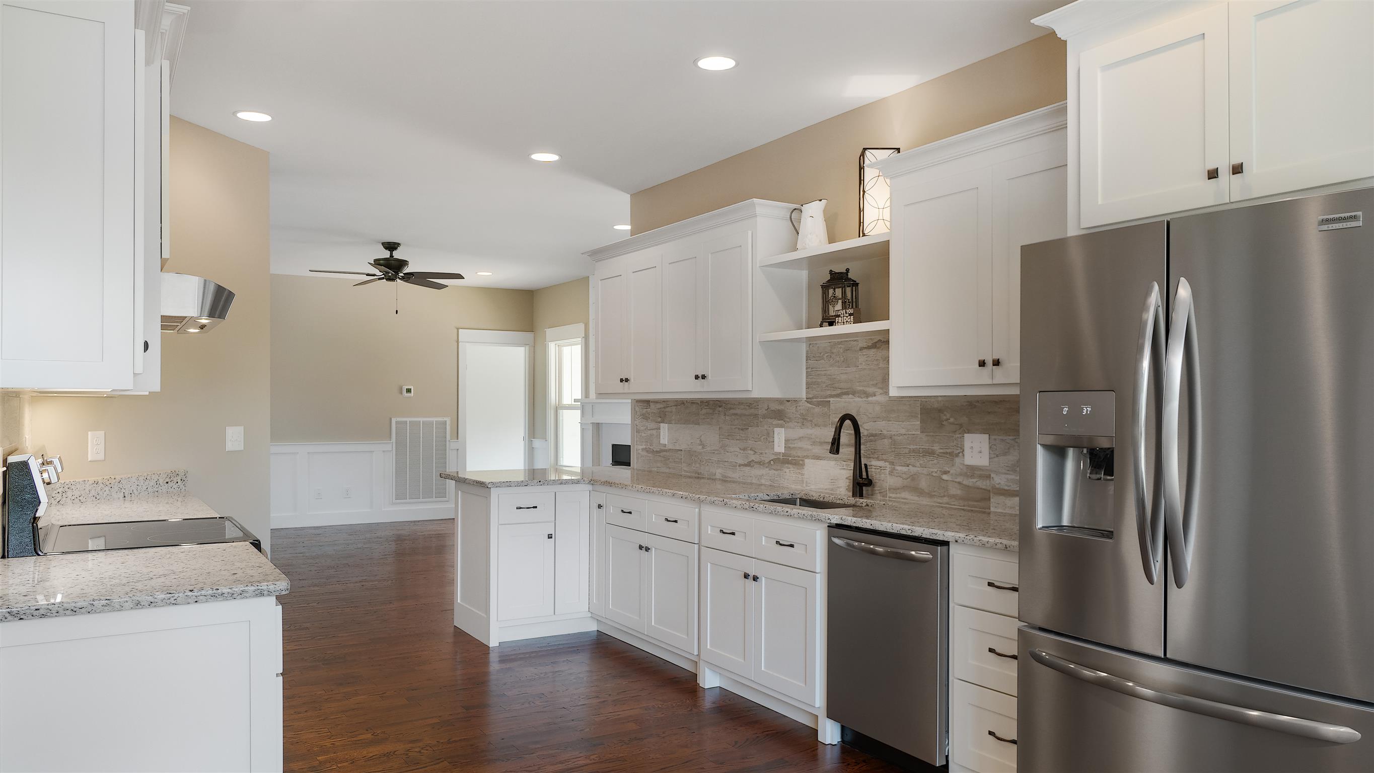 485 Tom Link Road Cottontown, TN 37048 - Photo 7 of 30 a kitchen with a refrigerator sink and cabinets