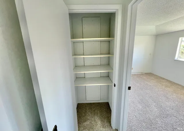 a white toilet sitting next to a sink