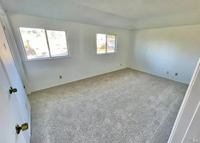 a view of a house with backyard and windows