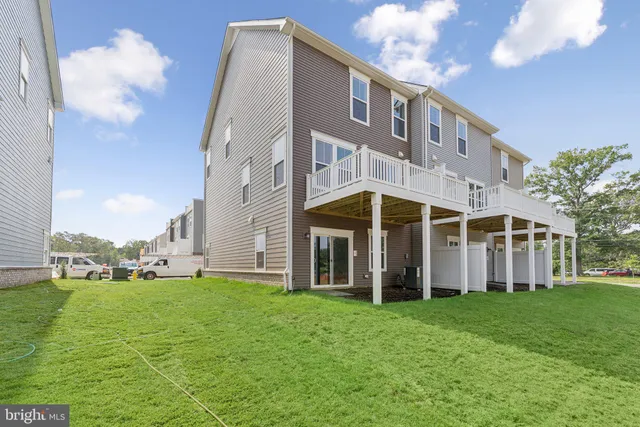 a view of a building with a yard