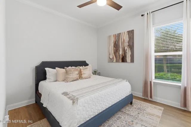 a bathroom with a granite countertop sink toilet and a mirror