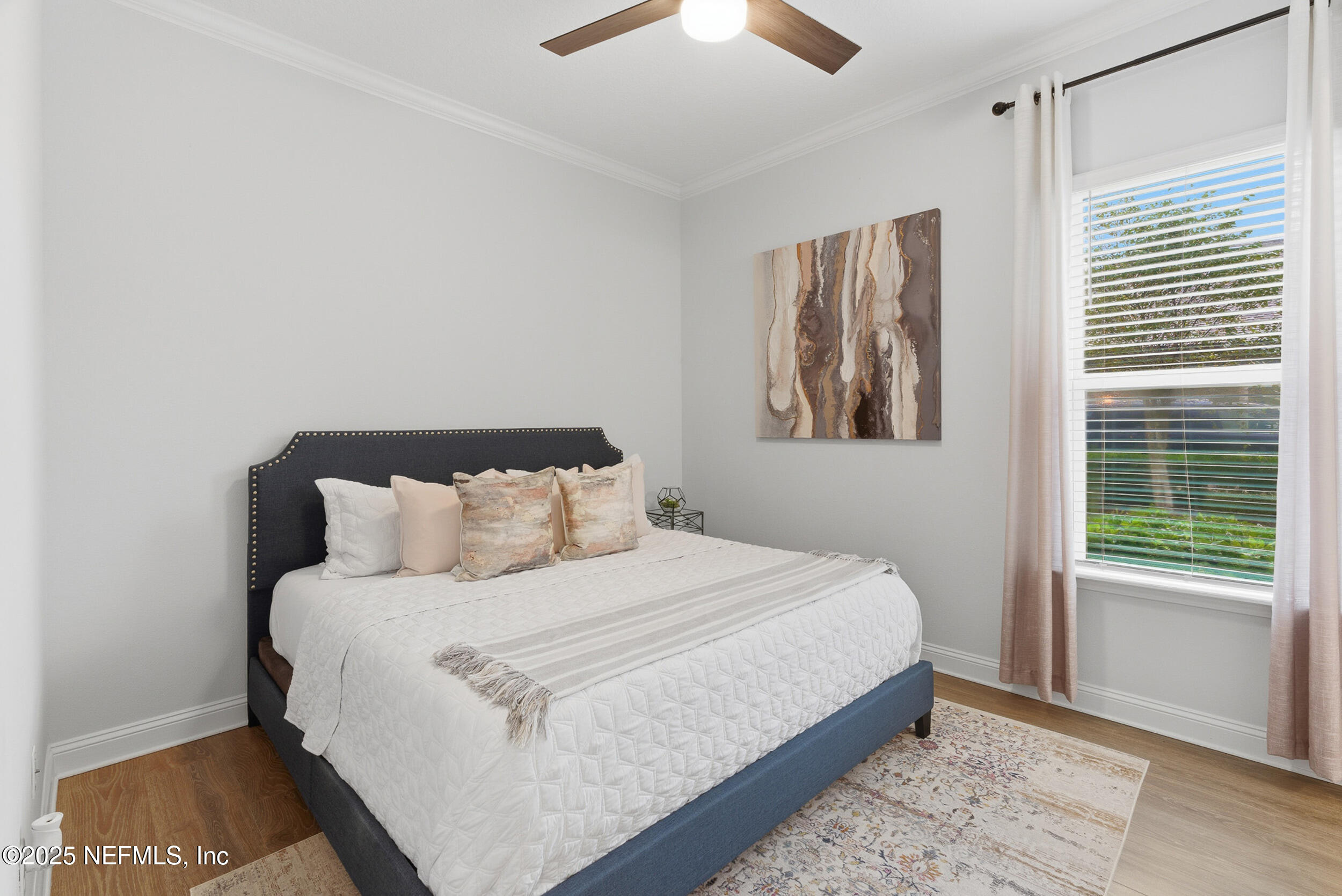 375 Kirkside Avenue St. Augustine, FL 32095 - Photo 10 of 49 a bedroom with a bed and a painting on the wall