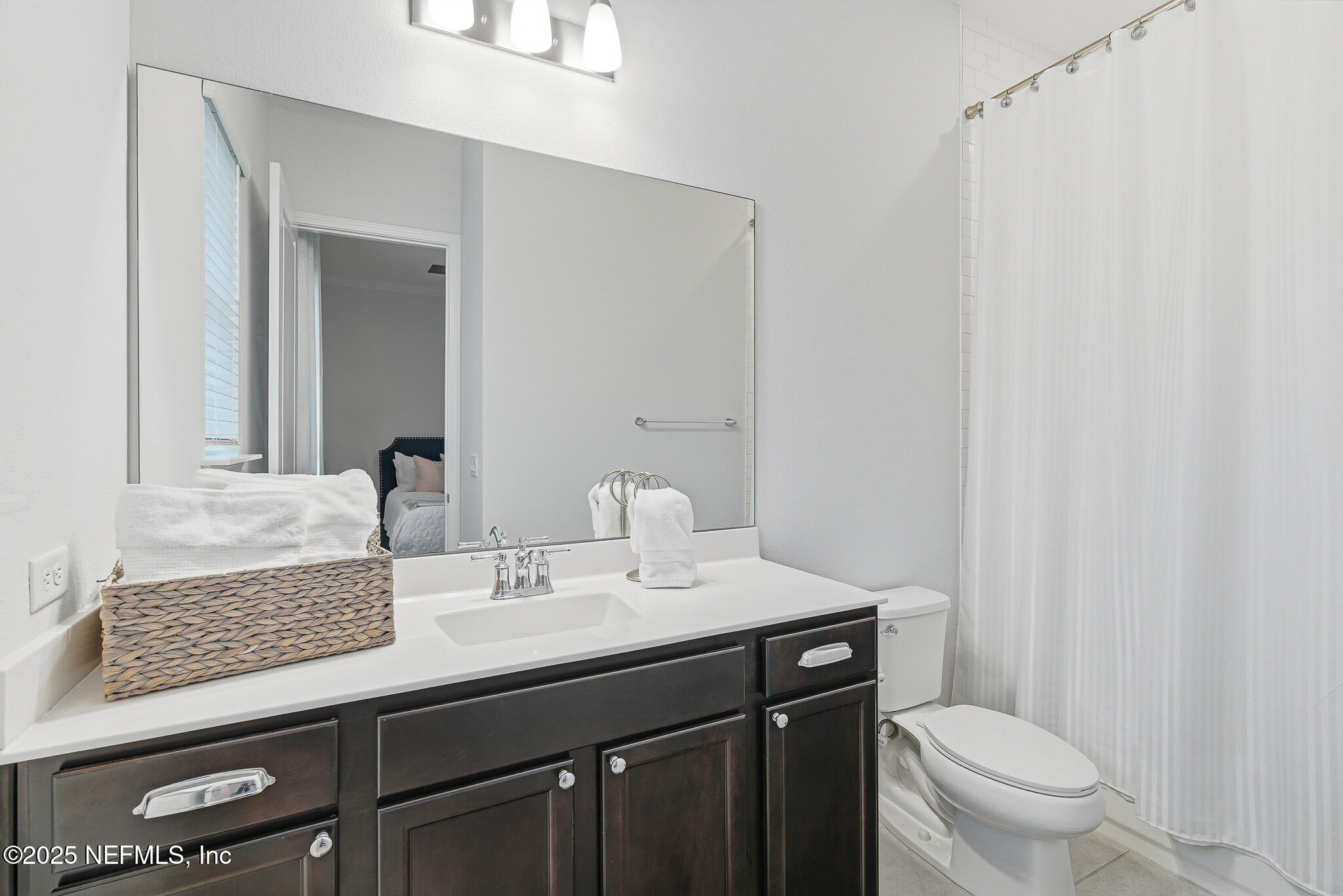 375 Kirkside Avenue St. Augustine, FL 32095 - Photo 11 of 49 a bathroom with a granite countertop sink toilet and a mirror
