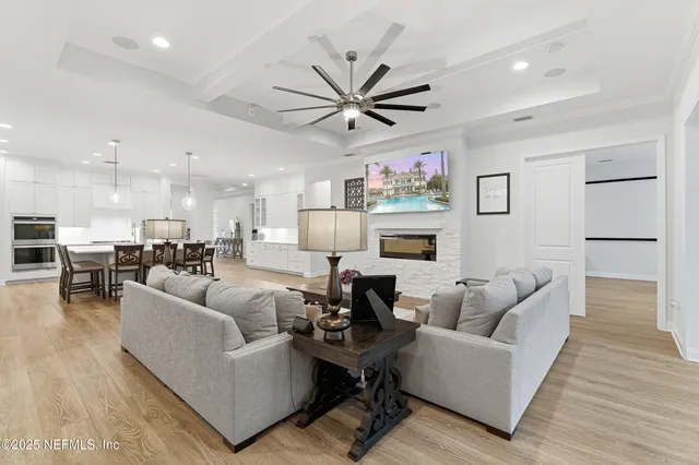 a living room with furniture a rug and a fireplace