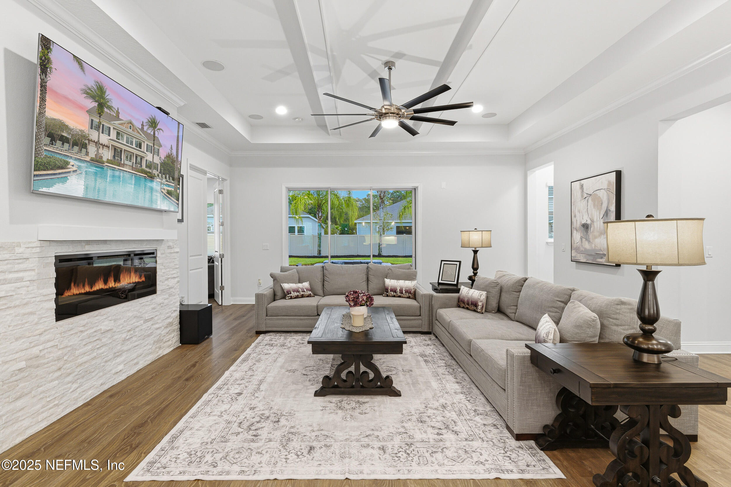 375 Kirkside Avenue St. Augustine, FL 32095 - Photo 16 of 49 a living room with furniture a rug and a fireplace