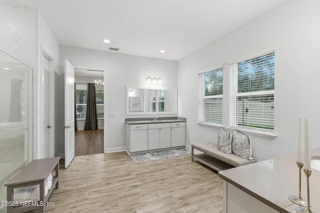 a bedroom with furniture and a window