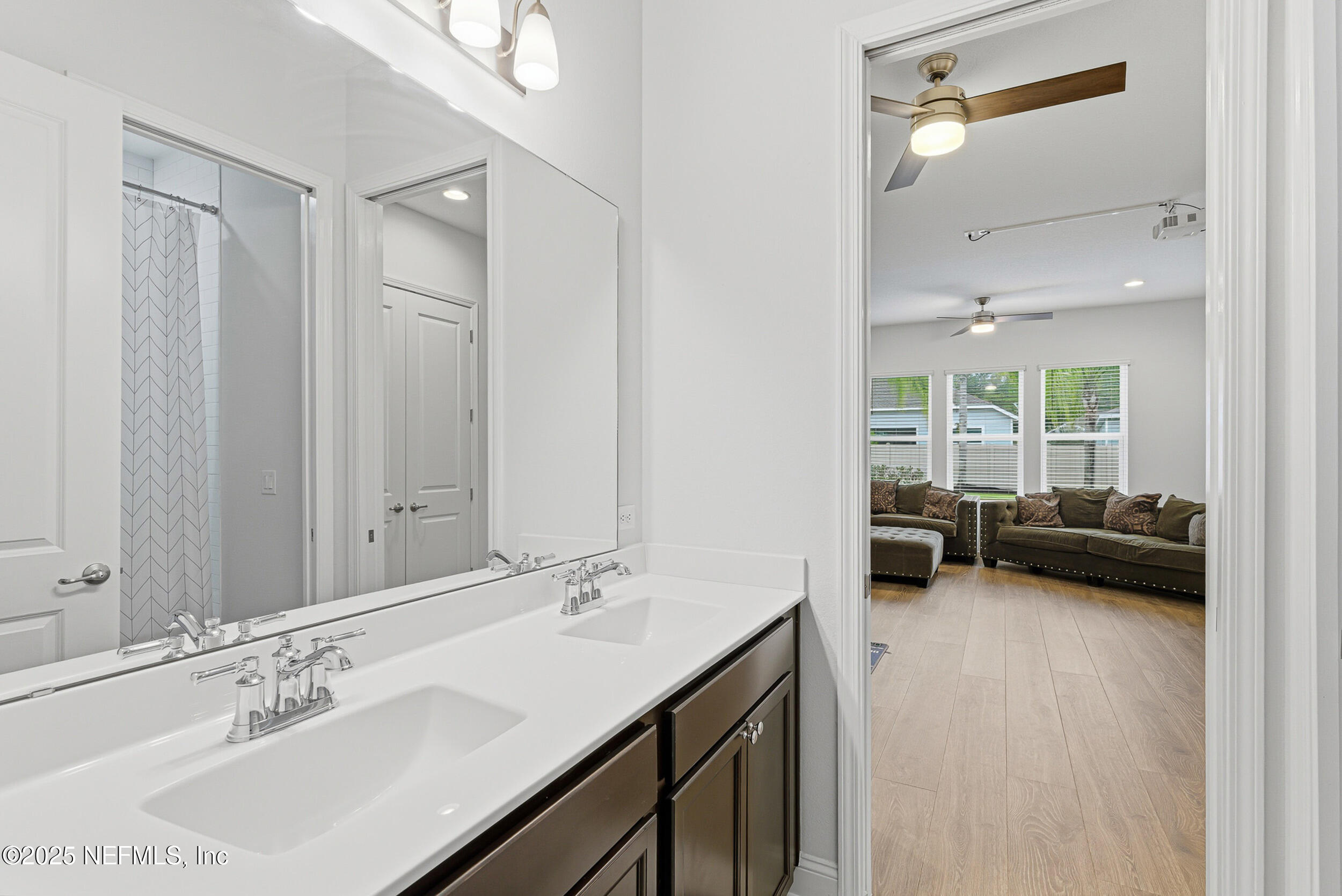 375 Kirkside Avenue St. Augustine, FL 32095 - Photo 22 of 49 a en suite bathroom with a double vanity sink and a mirror