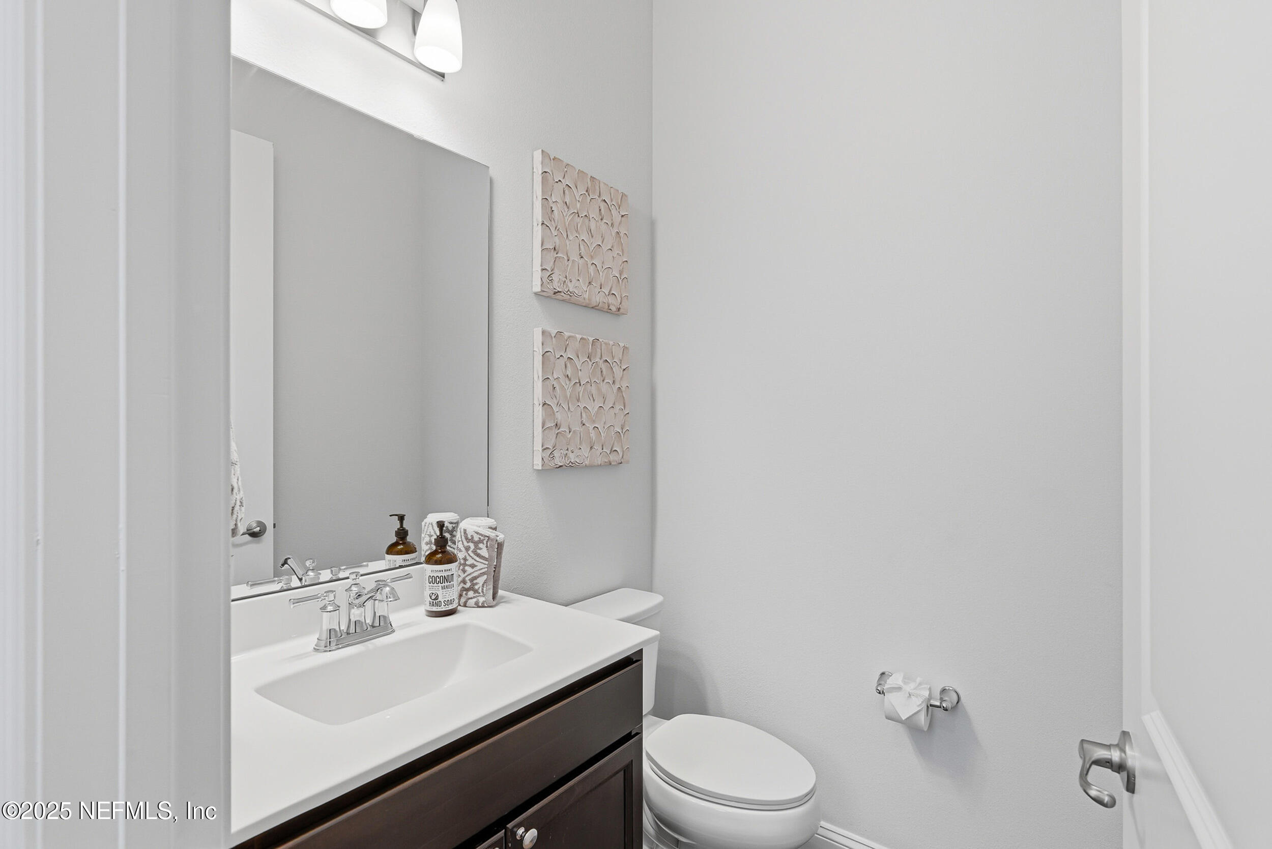 375 Kirkside Avenue St. Augustine, FL 32095 - Photo 24 of 49 a bathroom with a sink toilet and mirror