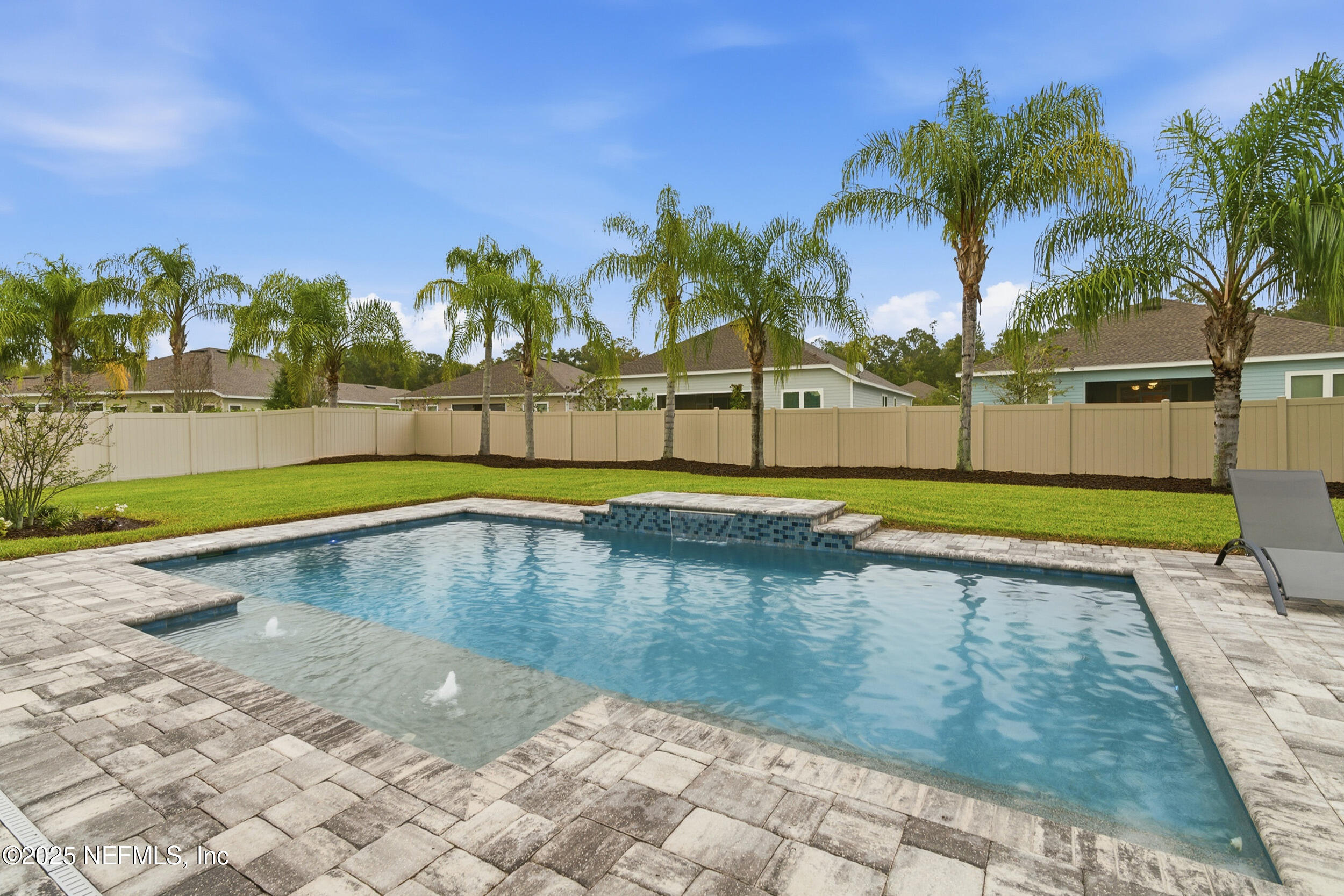 375 Kirkside Avenue St. Augustine, FL 32095 - Photo 26 of 49 a view of swimming pool with a lawn chairs under an umbrella