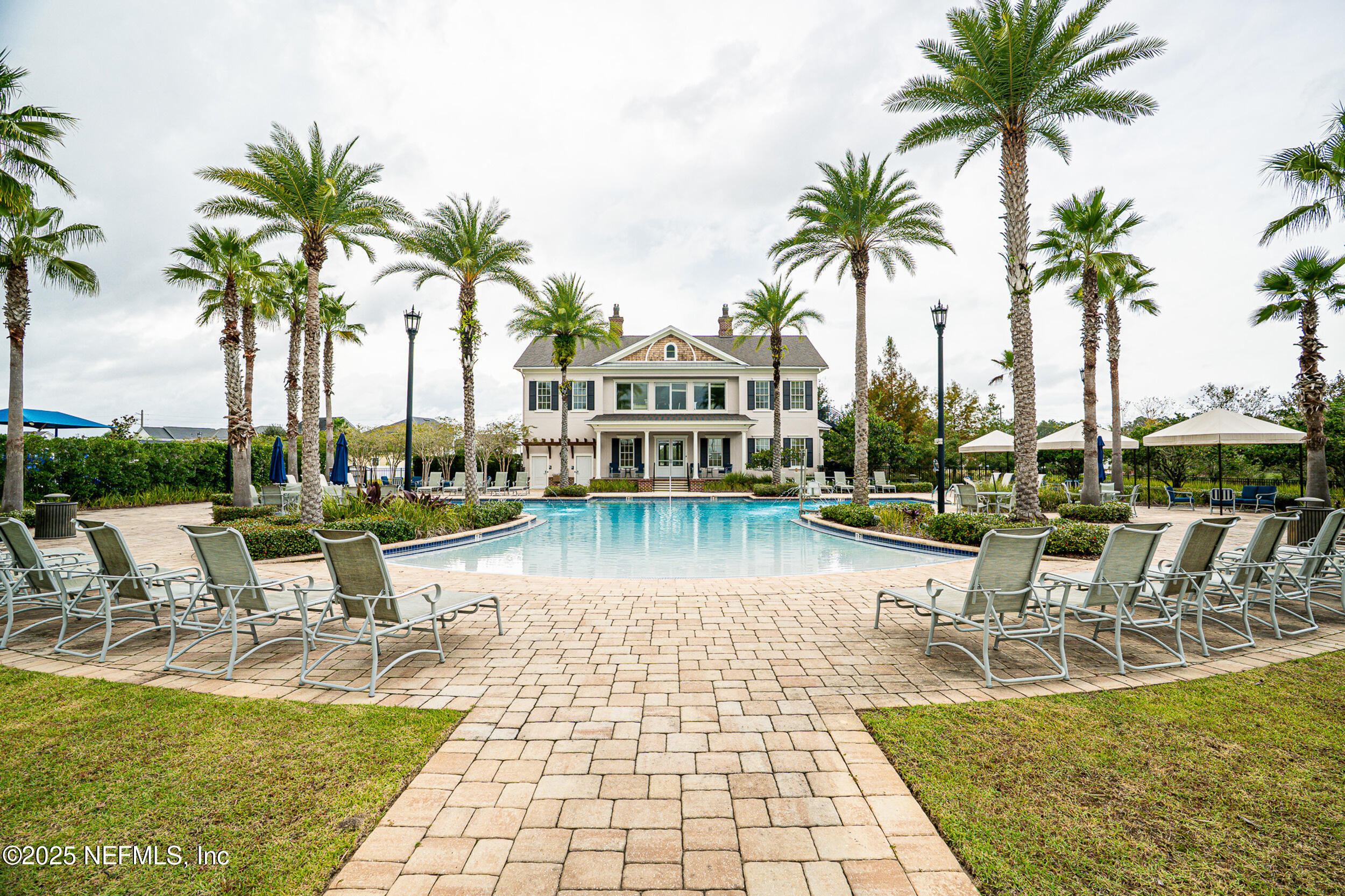 375 Kirkside Avenue St. Augustine, FL 32095 - Photo 39 of 49 a view of a swimming pool with a table and chairs