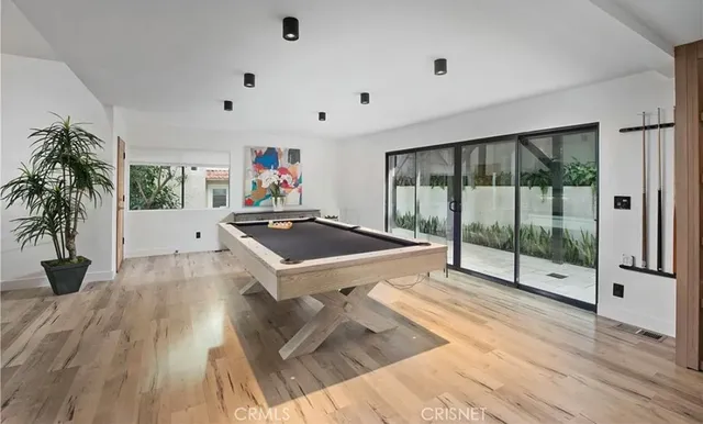 a bedroom with a large bed and a large window