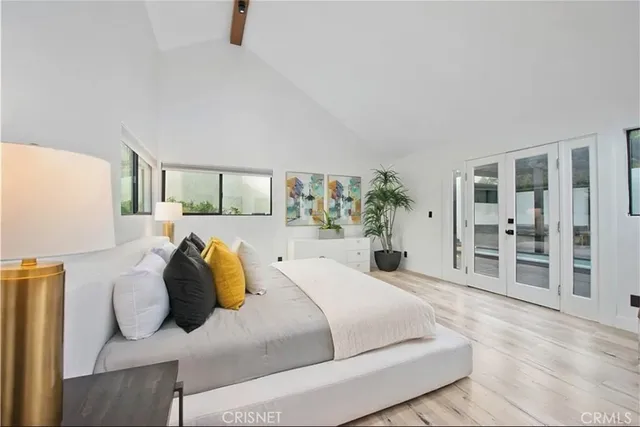 a view of hallway with wooden floor